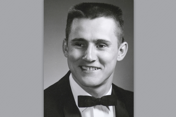 Michael in a black suit with a bow tie.