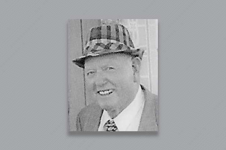 Charles wearing a checkered fedora.