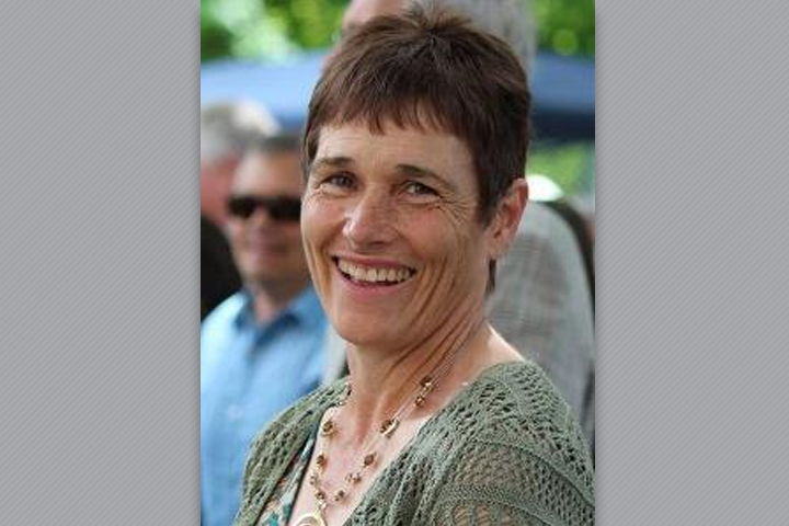 Aimee, very happy, at an outdoor function.