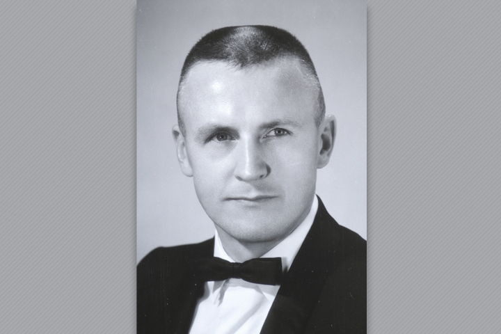 Dr. Oakshott in the suit with black bow tie.