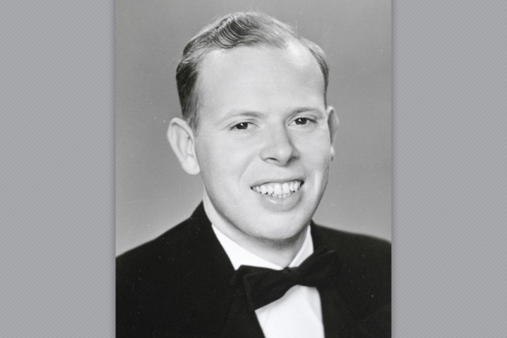 Dean in a suit including a bow tie.