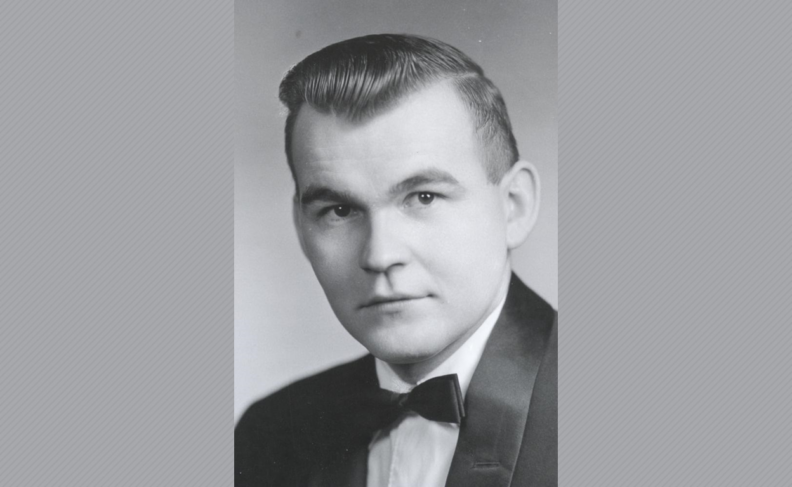 Black and white headshot of Robert Chase wearing a tuxedo.