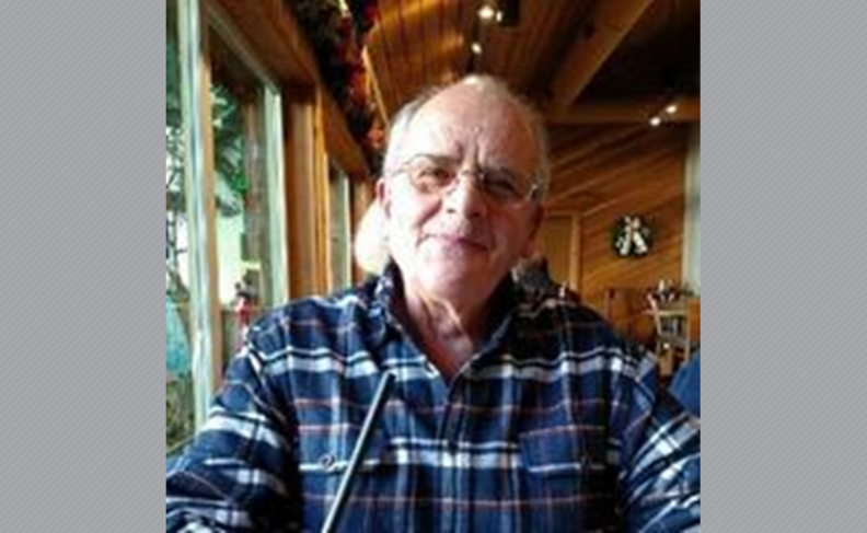 Sidney Curtright wearing glasses and a blue plaid shirt.