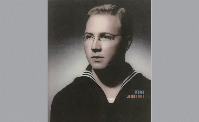 Robert Hedelius in glasses and Navy uniform.