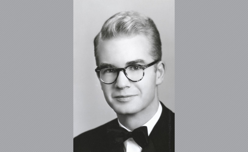 Black and white photo of William Hess in glasses and tuxedo.