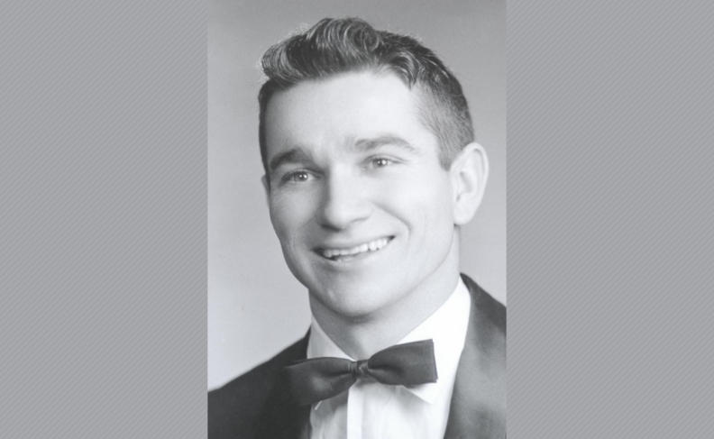 Black and white headshot of Robert Hogan in tuxedo.