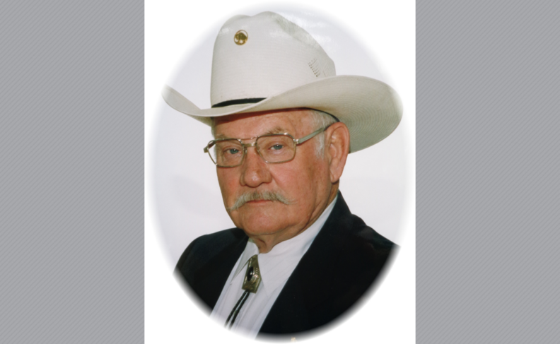Headshot of Owen James in white cowboy hat.