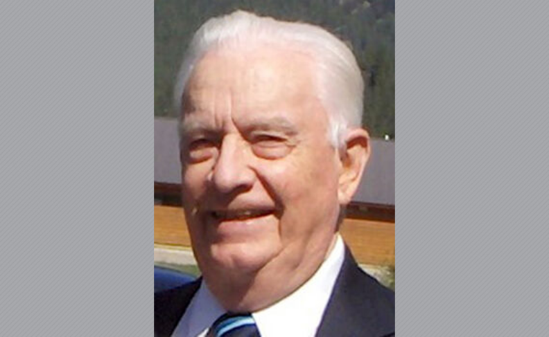 Roy Larson in suit and tie.