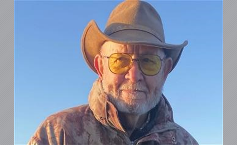 Robert Laughery in hat and glasses.