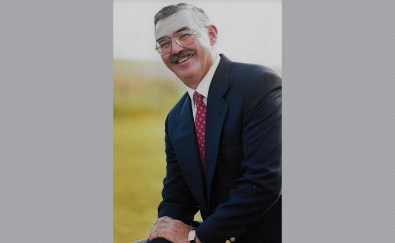 Patrick Long wearing suite and tie.