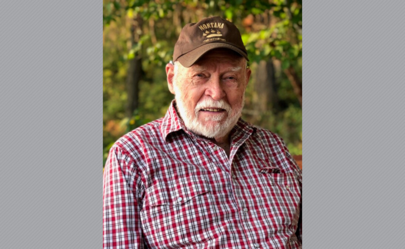 Dee Meek in brown ball cap and red and white checkered shirt.