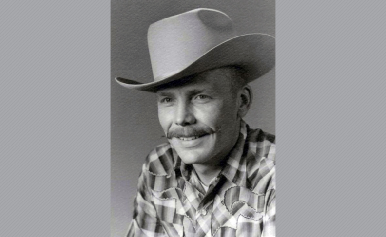 Bradford Newcomb wearing cowboy hat and plaid shirt.