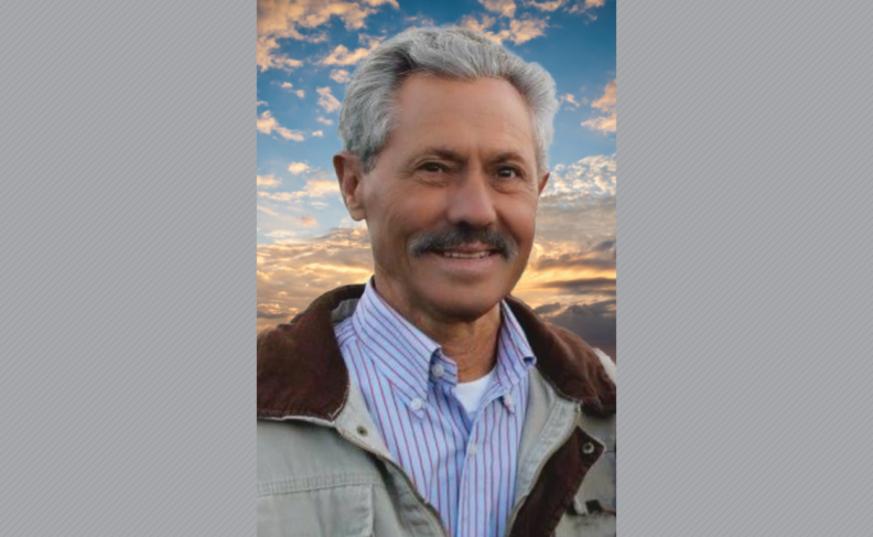 Rodney Proper with a background of sky and clouds.