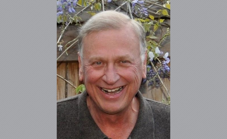 Headshot of Laurence Sams outdoors.