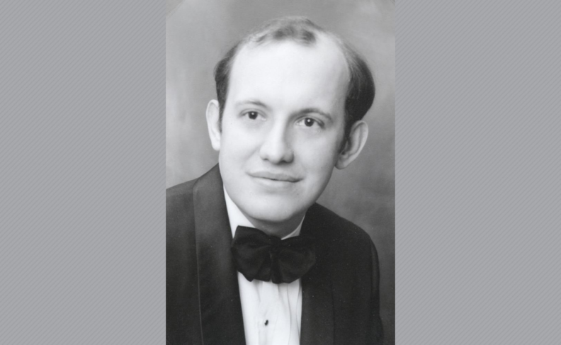 Black and white photo of Craig White wearing tuxedo.