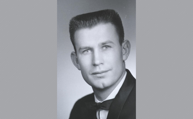 Black and white head shot photo of Dr. Grant in tuxedo.