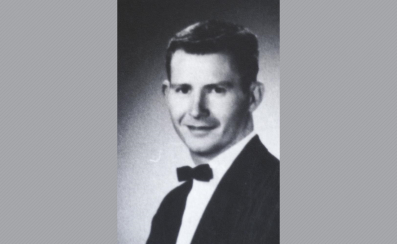 Black and white photo of Dr. Kelly in tuxedo.