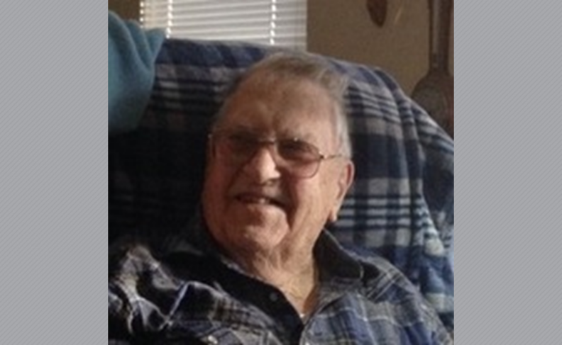 Photo of Dr. Maycumber in glasses and plaid blue shirt.