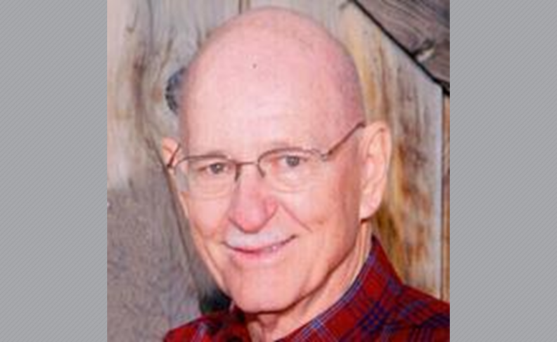 Photo of Dr. Sheets in glasses and red plaid shirt.