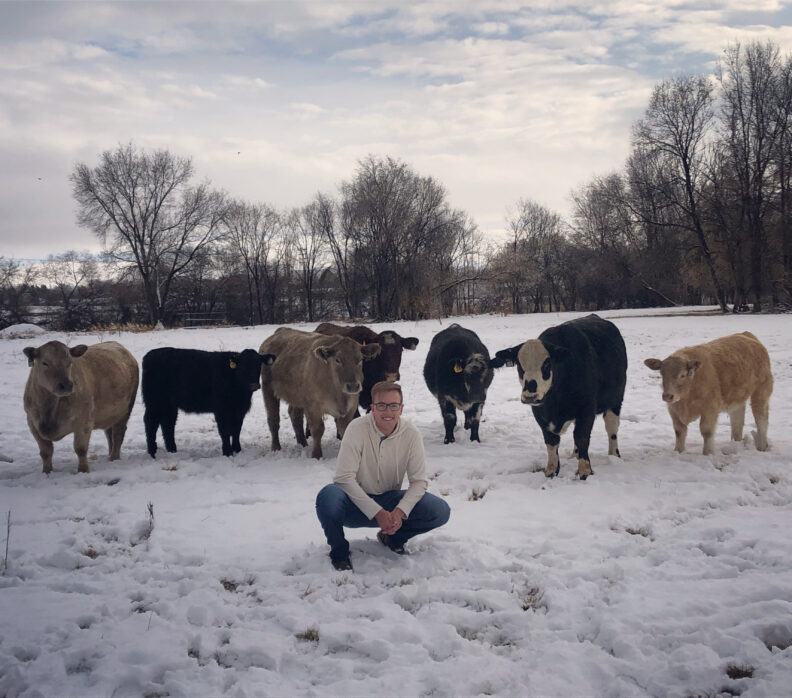 DVM student Brooklynn Balic stands with a cow