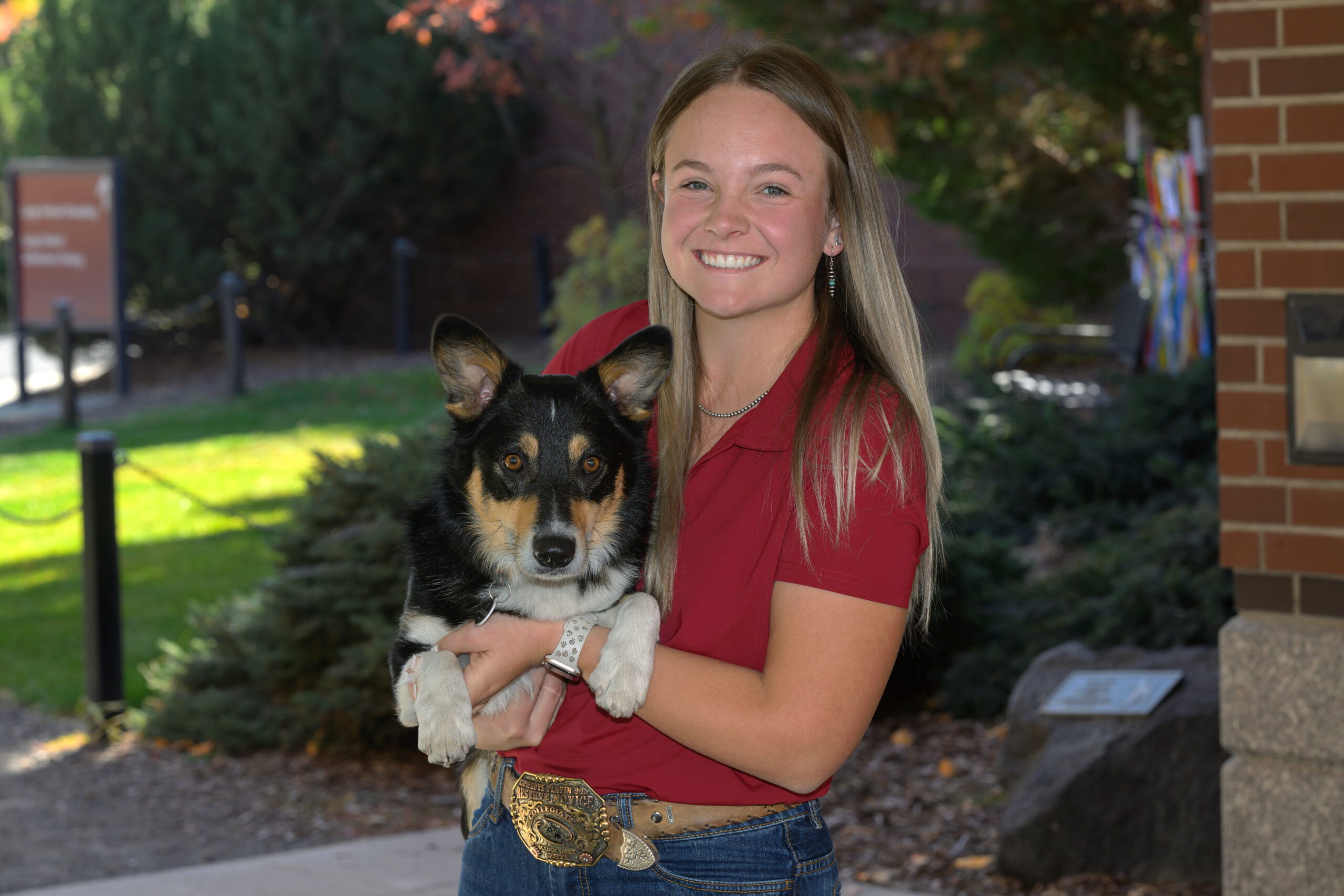 DVM Student Jordan Johnson holding her dog Rooster