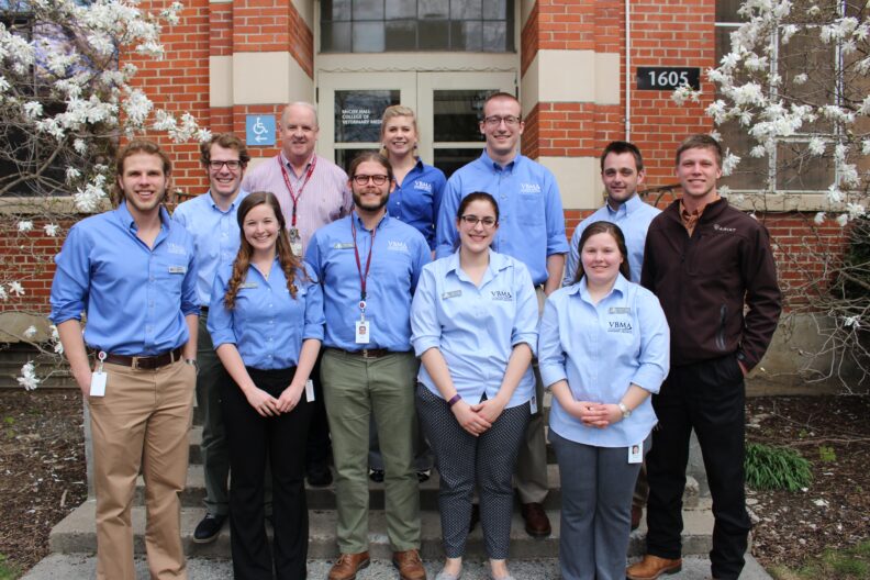 VBMA students stand together for a picture with their advisor