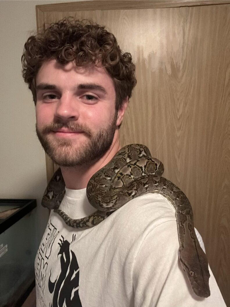 DVM student Brooklynn Balic stands with a cow