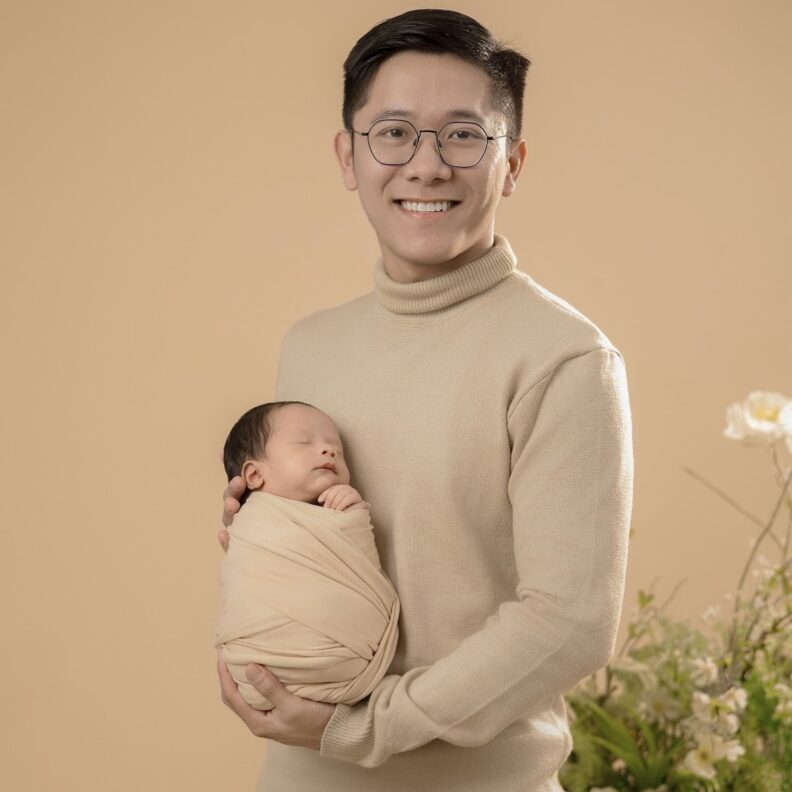 Nam Nguyen pictured with his newborn son Bach