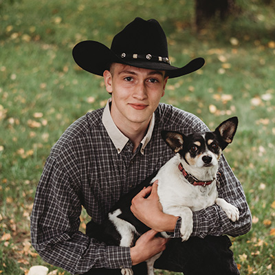 Bryer Follansbee holding his dog