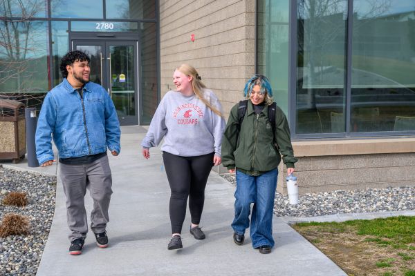 Washington State University students talking together on campus