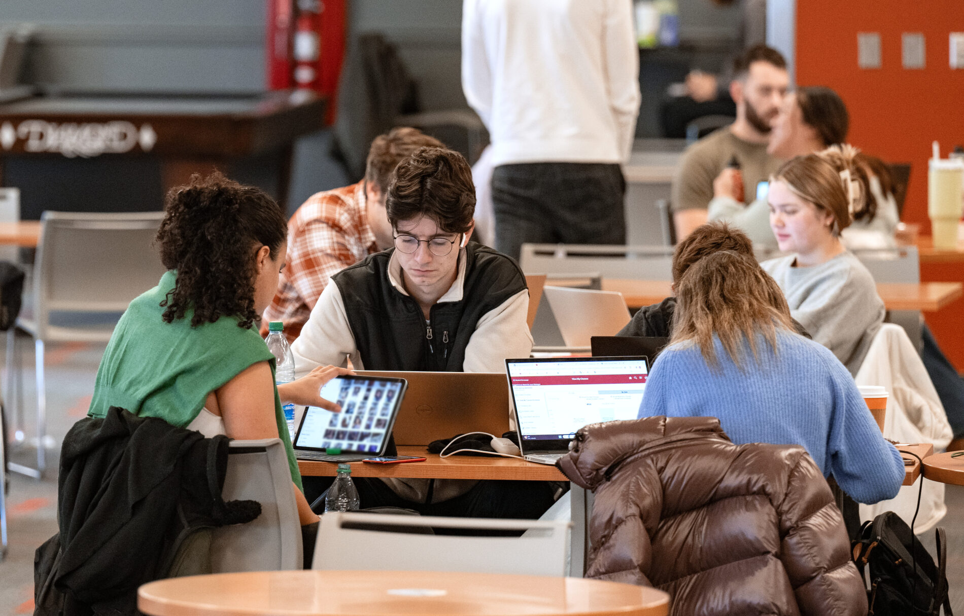 Washington State University's 12-foot-tall painted bronze sculpture, The Technicolor Heart, is a blue beacon covered with everyday items like hammers, shoes, clamps, and flashlights.