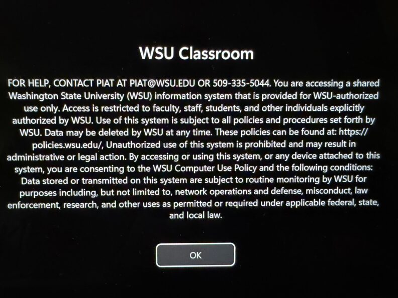 "WSU Classroom" use policy screen with a computer use notice explaining authorized access, monitoring, and data deletion. A single ‘OK’ button appears at the bottom to continue.