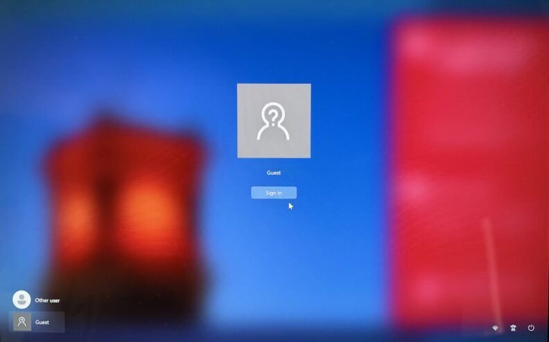 Windows sign‑in screen showing a ‘Guest’ account with a ‘Sign in’ button. ‘Other user’ and ‘Guest’ options are available.
