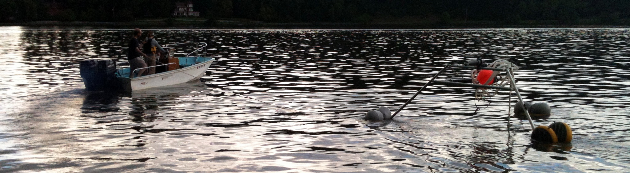 Dusk tripod deployment in lake water