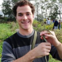 Mitch holding a garter snake in Wyoming
