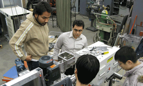 Dr. Garcia-Perez directs construction of bio-research equipment. Photo: BSysE staff