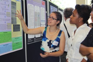 Sequoia Leuba (left) explaining her research at the recent Undergraduate Research Symposium.
