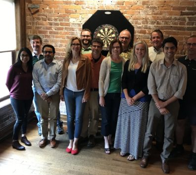 A group of people smiling