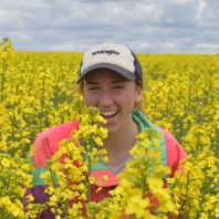 Rachel Breslauer in a canola field.