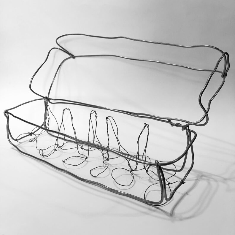 Wire sculpture of an egg carton.