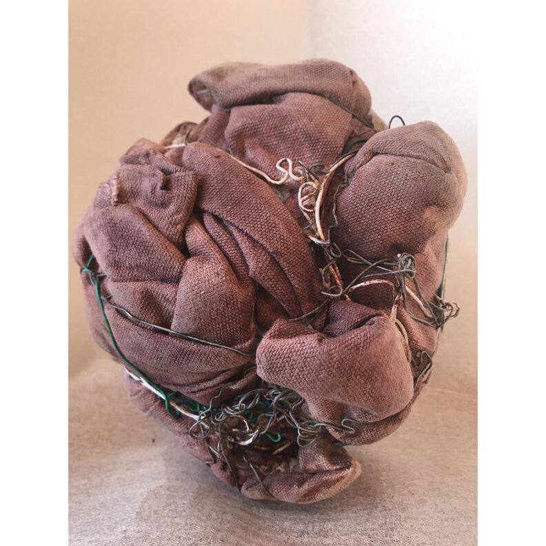 Canvas balled up and wrapped with wire