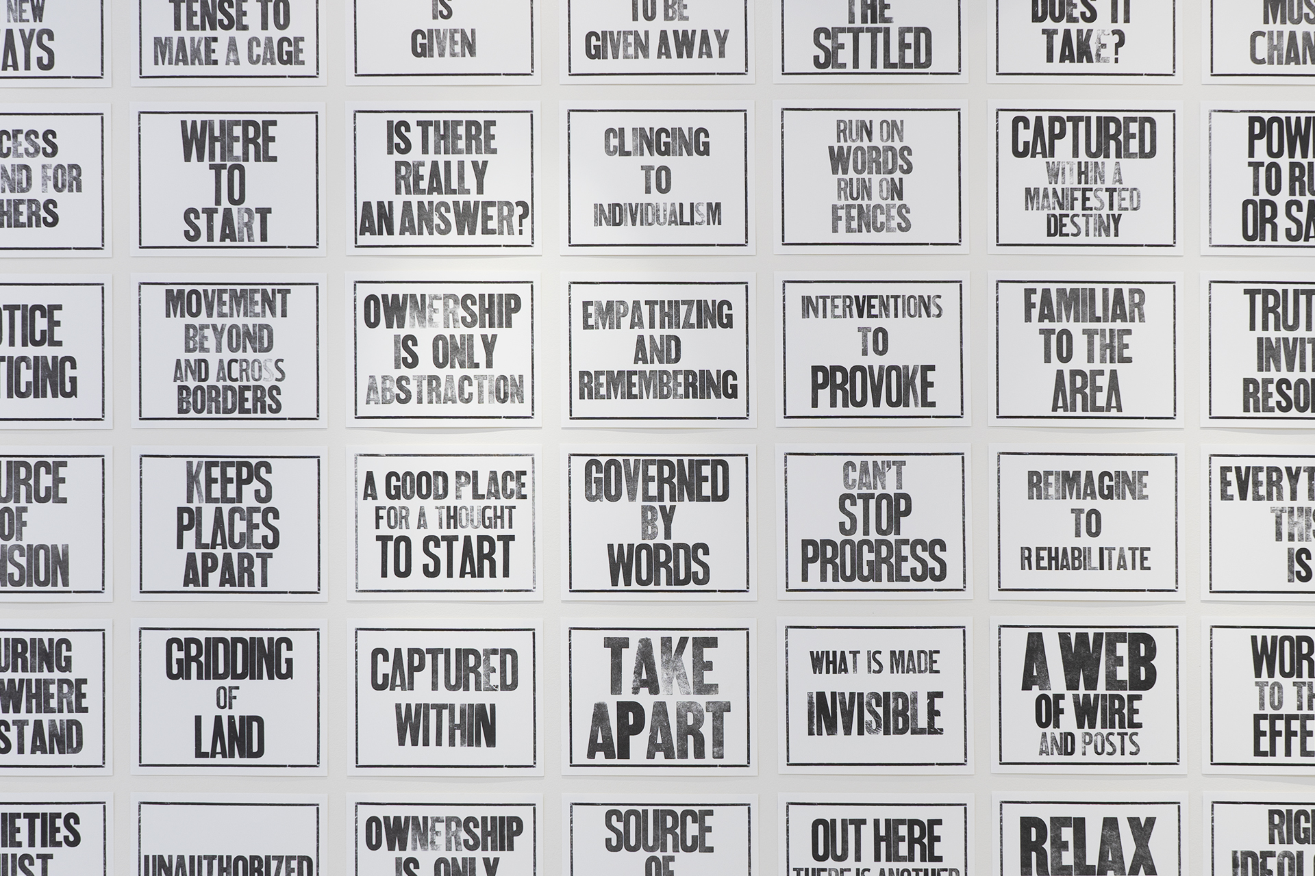 2D artwork - many signs with black text.