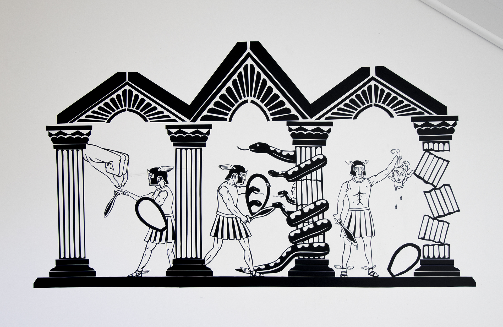 Black 2D artwork on walls