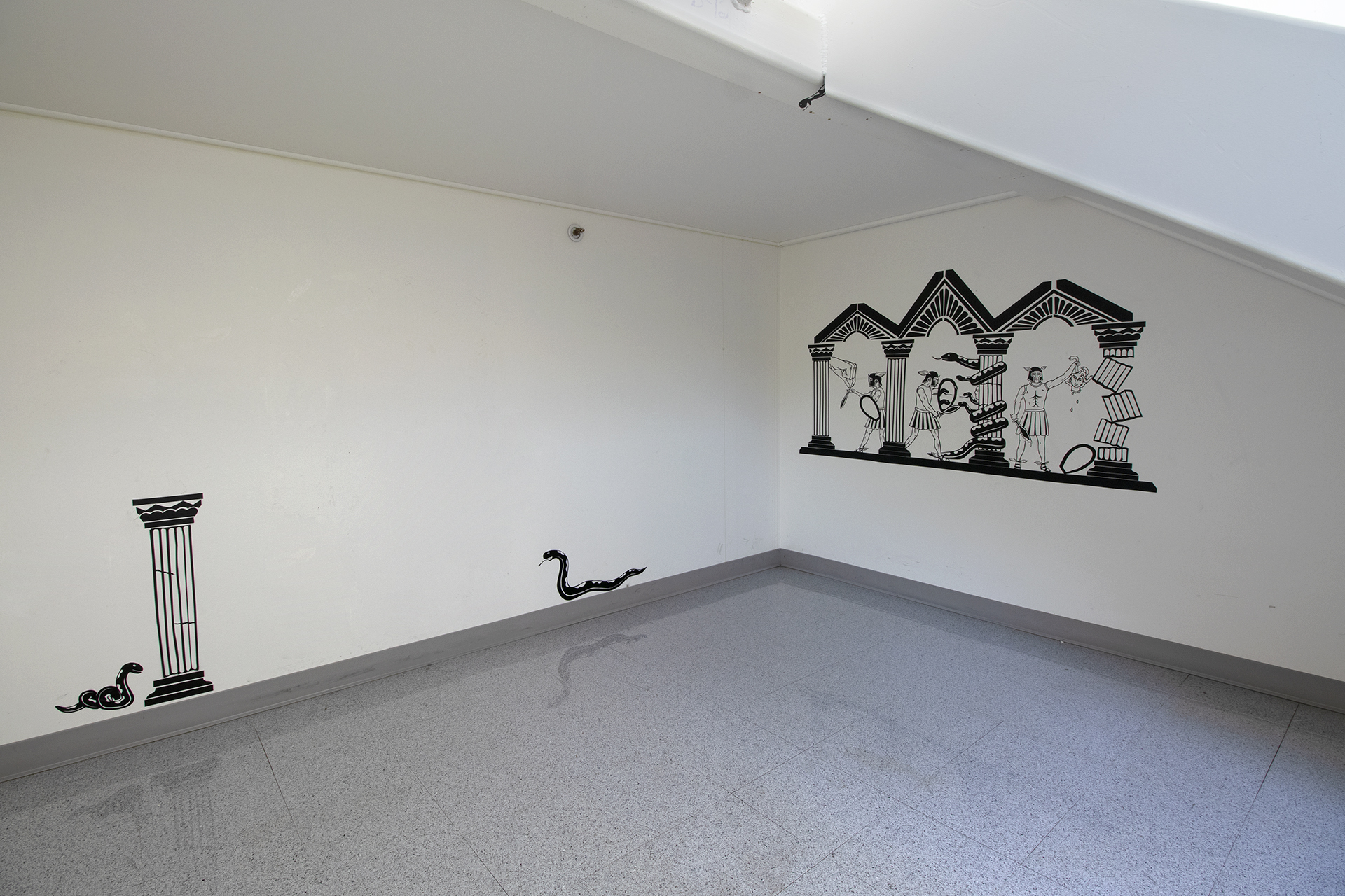 Black 2D artwork on walls