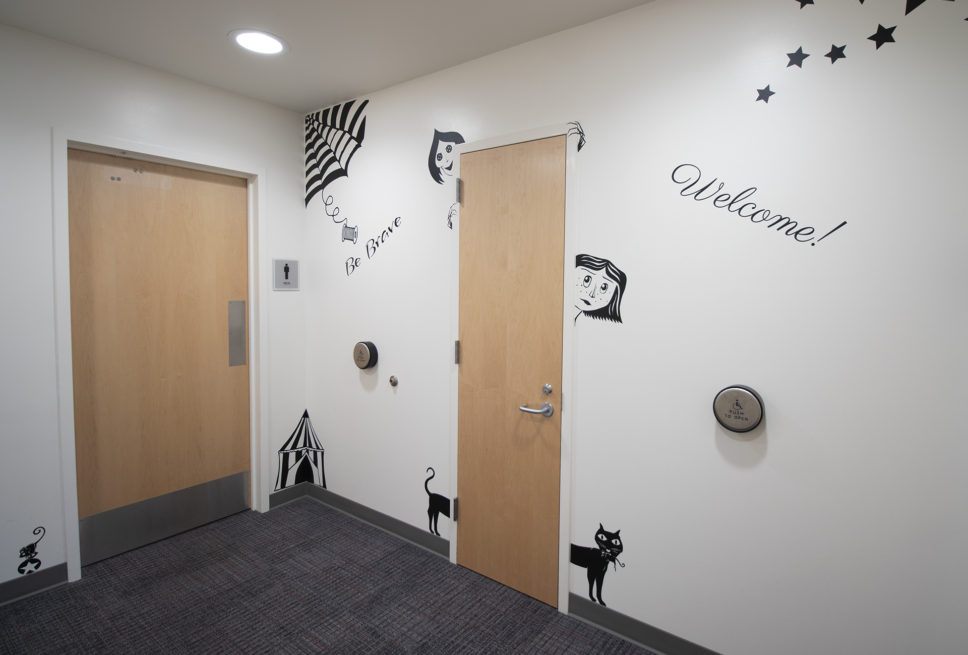 Black 2D artwork on walls