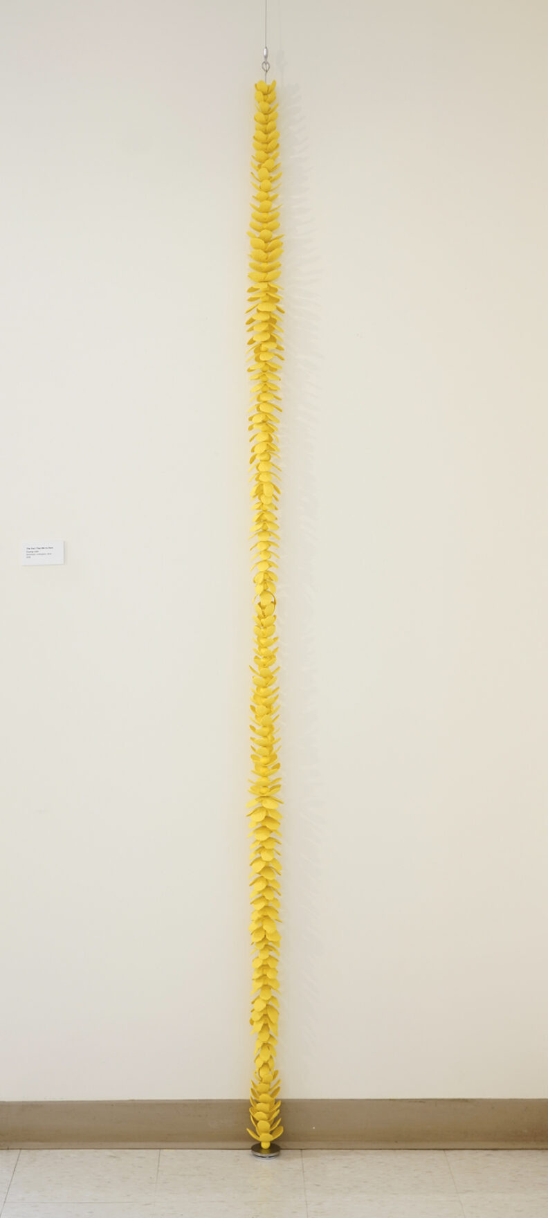 Column of yellow ceramic petals.