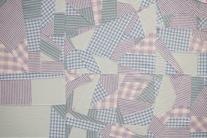 Zoomed in shot of one of Kacy's collaged fabric works.