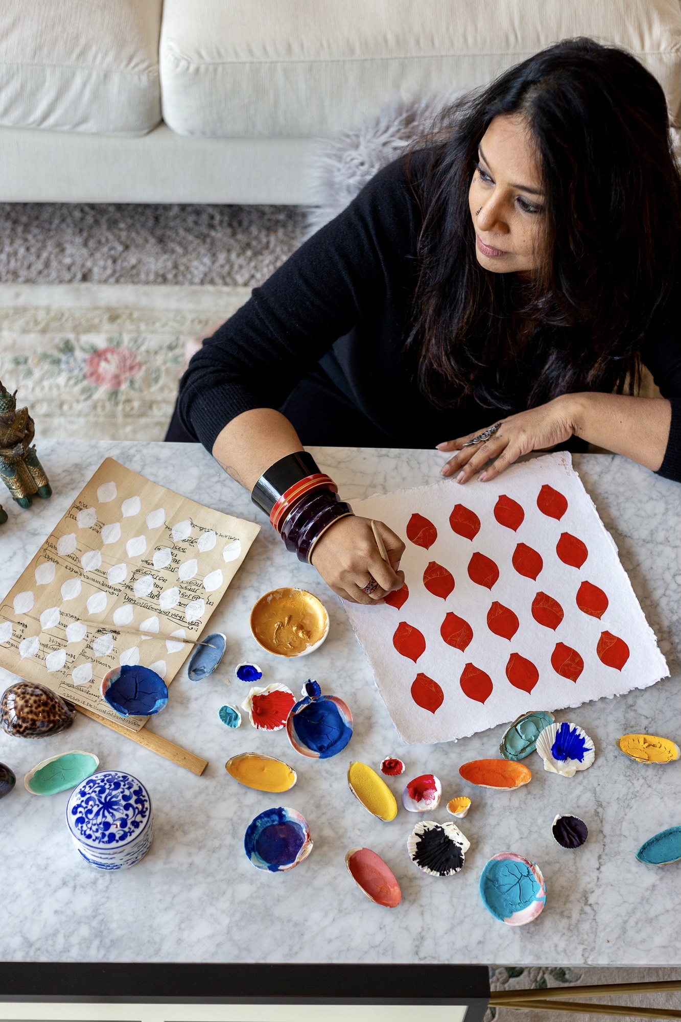 Mini painting with her hand made paints.