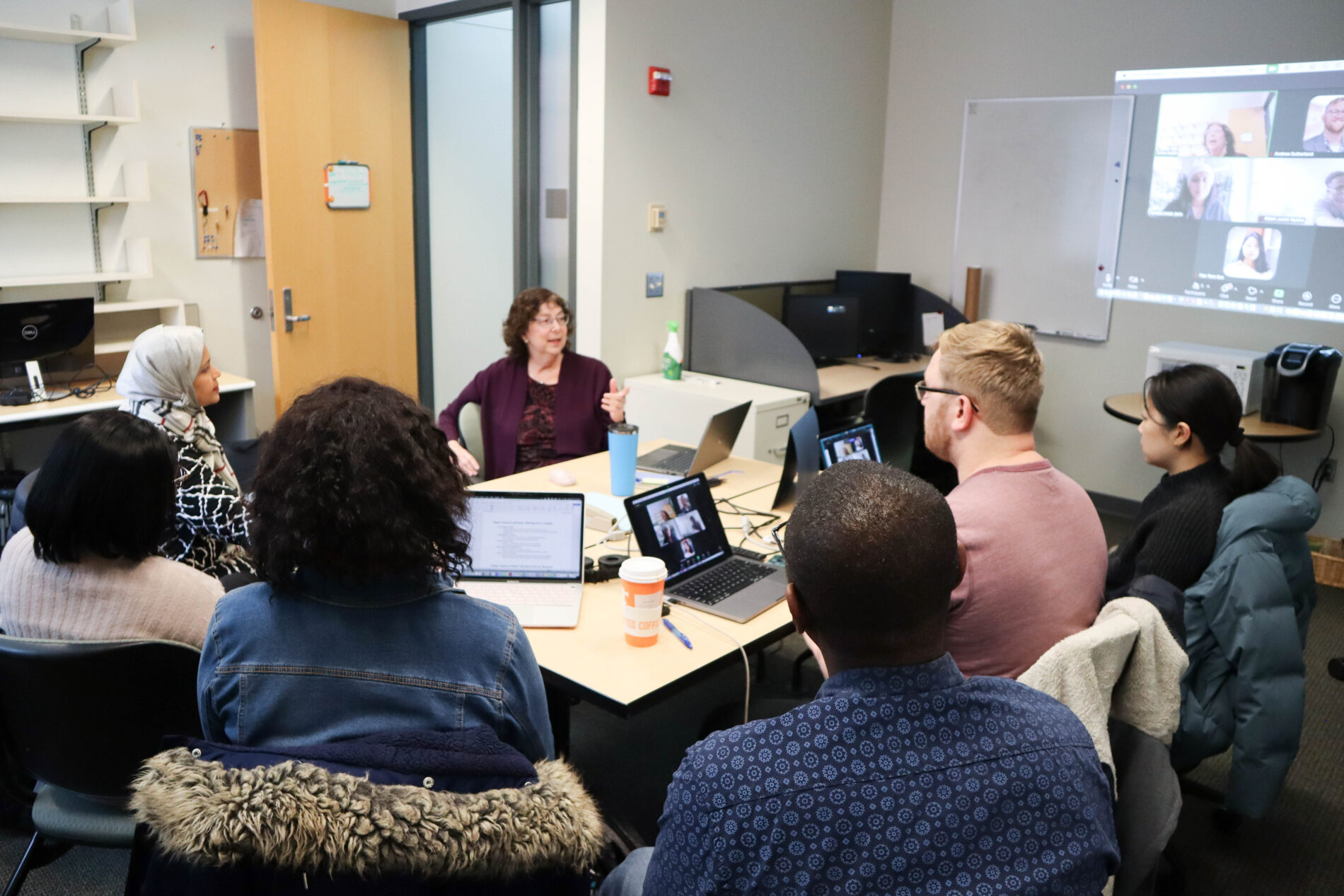 Group of people working in the Edward R. Murrow Center for Media & Health Promotion Research