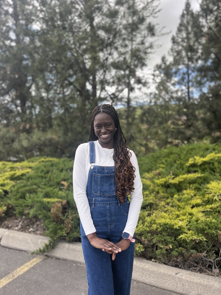 Picture of Dammy Olanrewaju smiling outside.